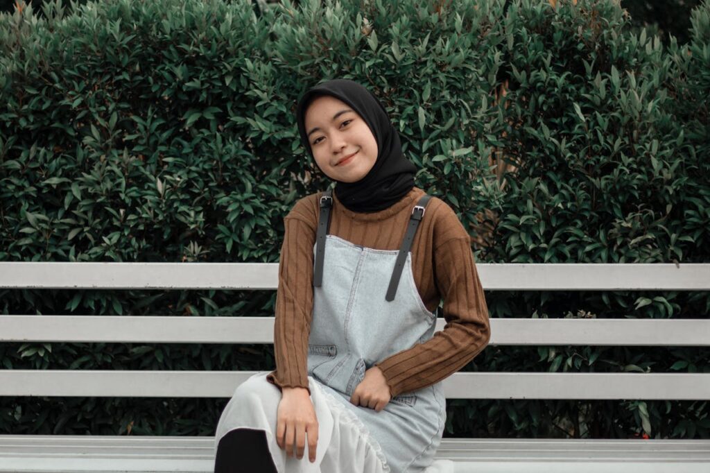 Woman Wearing Jumper Sitting on a Bench